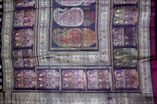 Pallav of a Baluchar Sari woven in silk Brocade From Murshidabad,West Bengal,India.The motifs of butta cones and Figures of Europeans travelling in railway carriages.British administrators were instrumental in reviving the industry there  ...