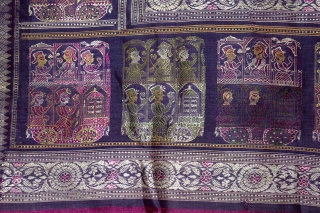 Pallav of a Baluchar Sari woven in silk Brocade From Murshidabad,West Bengal,India.The motifs of butta cones and Figures of Europeans travelling in railway carriages.British administrators were instrumental in reviving the industry there  ...