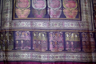 Pallav of a Baluchar Sari woven in silk Brocade From Murshidabad,West Bengal,India.The motifs of butta cones and Figures of Europeans travelling in railway carriages.British administrators were instrumental in reviving the industry there  ...