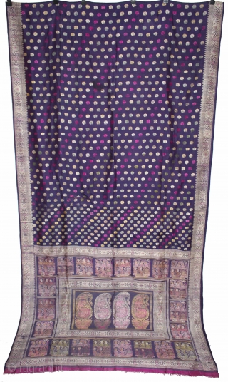 Pallav of a Baluchar Sari woven in silk Brocade From Murshidabad,West Bengal,India.The motifs of butta cones and Figures of Europeans travelling in railway carriages.British administrators were instrumental in reviving the industry there  ...