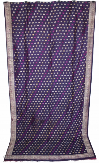 Pallav of a Baluchar Sari woven in silk Brocade From Murshidabad,West Bengal,India.The motifs of butta cones and Figures of Europeans travelling in railway carriages.British administrators were instrumental in reviving the industry there  ...