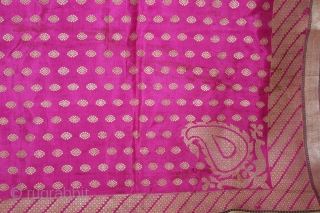 Odhni Zari Brocade(Real Silver and Gold) from Jamnagar Gujarat India.The pattern is made up of kairi,paisley, placed as a konia at the corners of the pallu.The broad plain chaudani pallu is outlined  ...