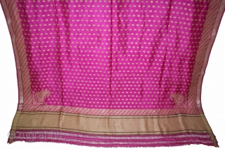 Odhni Zari Brocade(Real Silver and Gold) from Jamnagar Gujarat India.The pattern is made up of kairi,paisley, placed as a konia at the corners of the pallu.The broad plain chaudani pallu is outlined  ...