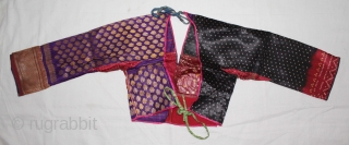 Child's(choli) from Bansali Community,kutch,Gujarat India early 20th century. Left side panel used Ambar Brocade. Right side panel used Aba Silk Fabric.(DSC01530).            