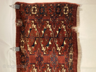 Early to mid 19th century Tekke torba, with unusual 9 gul format.
Great colour and crisp drawing, with very supple handling. Note holes in top right and bottom right borders, and faint ink  ...