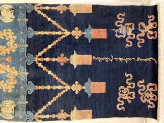 19th century pillar rug 2.07m by 0.97m
Full pile rug, the white wool has corroded noticeably to the surrounding pile. 
Note the Mongolian (?) script, and mixture of religious motifs, e.g.cranes, dragons, buddhist  ...