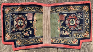 Early 20th century Tibetan saddle rug in good condition for its age.
1.29m by 0.62m
Contact gene@heritage-antique-rugs.com for more pics, price etc.             