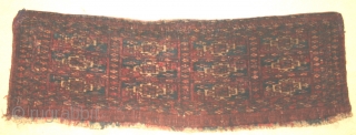 Tekke mafrash bagface, no tip-faded or runny colours.
31" by 11". Old repairs to top corners. A charming if sombre weaving.             