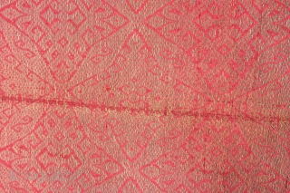 Late 19th-early 20th century songket, silk and metallic (gold?) thread, from Northern Malaysia. Originally a high-status fabric, worn by royalty as a sash on special occasions.78in by 24in. Small repairs and crease  ...