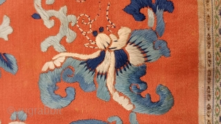 1’1 x 1’3 Chinese Embroidery Panel, 19th Century, featuring peony blossoms and 
butterflies embroidered in shades of blue and white on persimmon orange          
