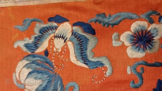 1’1 x 1’3 Chinese Embroidery Panel, 19th Century, featuring peony blossoms and 
butterflies embroidered in shades of blue and white on persimmon orange          