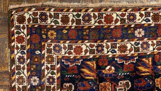 Small Afshar Carpet, 5’3” x 6’6” / 169 x 198 cm.
Floral pattern in field, on indigo ground; white ground 
secondary borders, indigo ground central border 
Good pile.      