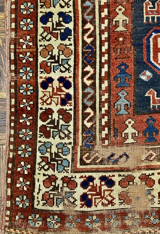 Kurdish Long Rug, 3’11 x 9’10 / 119 x 300 cm., Field divided
into four sections, each section contains a quatrefoil medallion
surrounded by small animals, angular “S” -shaped and reciprocal
floral sprays in borders 