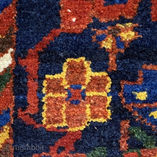 Small Afshar Carpet, 5’3” x 6’6” / 169 x 198 cm.
Floral pattern in field, on indigo ground; white ground 
secondary borders, indigo ground central border 
Good pile.      