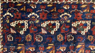 Small Afshar Carpet, 5’3” x 6’6” / 169 x 198 cm.
Floral pattern in field, on indigo ground; white ground 
secondary borders, indigo ground central border 
Good pile.      