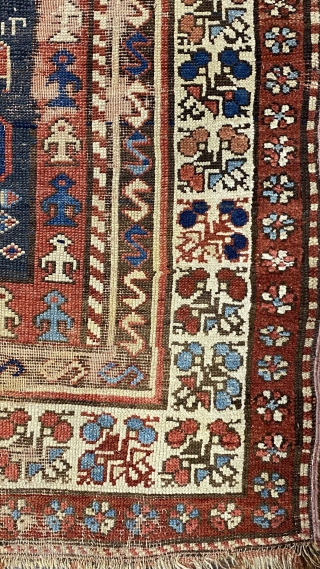 Kurdish Long Rug, 3’11 x 9’10 / 119 x 300 cm., Field divided
into four sections, each section contains a quatrefoil medallion
surrounded by small animals, angular “S” -shaped and reciprocal
floral sprays in borders 