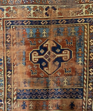 Kurdish Long Rug, 3’11 x 9’10 / 119 x 300 cm., Field divided
into four sections, each section contains a quatrefoil medallion
surrounded by small animals, angular “S” -shaped and reciprocal
floral sprays in borders 