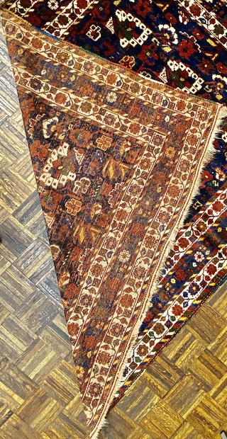 Small Afshar Carpet, 5’3” x 6’6” / 169 x 198 cm.
Floral pattern in field, on indigo ground; white ground 
secondary borders, indigo ground central border 
Good pile.      