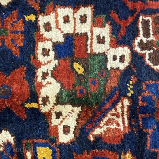 Small Afshar Carpet, 5’3” x 6’6” / 169 x 198 cm.
Floral pattern in field, on indigo ground; white ground 
secondary borders, indigo ground central border 
Good pile.      