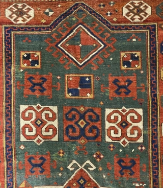 Karagashli Caucasian Prayer Rug; ca 1875;  4’2” x 6’3” / 127 x 190 cm.
Rich emerald green reentrant field with a concentric 8-sided medallion arrangement 
and symmetrical pairs of hooked squares in  ...