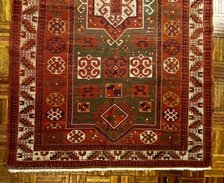 Karagashli Caucasian Prayer Rug; ca 1875;  4’2” x 6’3” / 127 x 190 cm.
Rich emerald green reentrant field with a concentric 8-sided medallion arrangement 
and symmetrical pairs of hooked squares in  ...