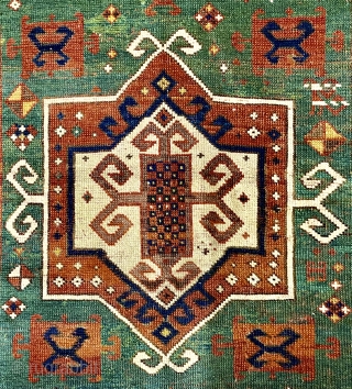 Karagashli Caucasian Prayer Rug; ca 1875;  4’2” x 6’3” / 127 x 190 cm.
Rich emerald green reentrant field with a concentric 8-sided medallion arrangement 
and symmetrical pairs of hooked squares in  ...