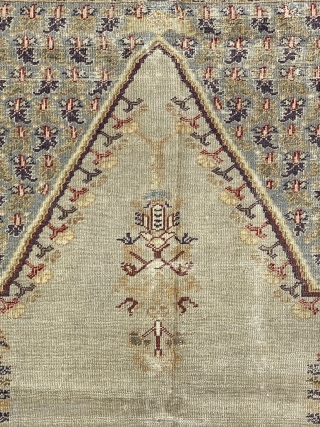 Turkish Panderma prayer rug, ca. 1850;  4ft. x 6ft. / 140 x 186 cm.

Pale-olive, multi-faceted mihrab, with a floral “mosque lamp”, two floral columns,
and four flowering shrubs; at the spandrels, a  ...