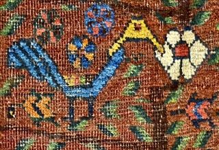 S.W. Per-zian  rug, 4’10” x 6’4” / 147 x 193 cm.

Mahogany brown field adorned with a flowering tree with whimsical 

birds and generously proportioned blossoms. Two reserves in red, to 

the  ...