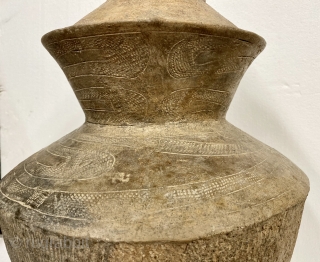 Bang Chaing Ceramic Vessel, Thailand, ca. 2nd Millennium BCE;

Height: 18”/ 46cm.

Opening Diameter: 4”/ 10cm.

Maximum width-Diameter: 11”/ 28 cm.

Base Diameter: 6 1/2” /  16.5 cm.

Ancient ceramic with incised decorations of dragons or  ...