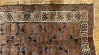 Afghan Balauch rug, ca. 1880;  3’4” x 6’6” / 102 x 198 cm.;

Field of “boxed cabbage” leaves and a running dog border variant as 

trunks and branches. Main border cross-hatch totems  ...