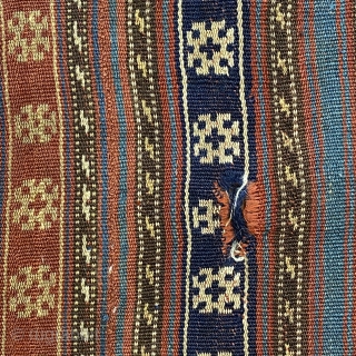 Jajim, ca. 1890; 5’9” x 6’0” / 175 x 183 cm.

Field adorned with multicolored bands and totemic symbols, wear at the sides, a few discreet 

holes, and one re-sewn cut.   