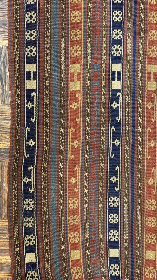 Jajim, ca. 1890; 5’9” x 6’0” / 175 x 183 cm.

Field adorned with multicolored bands and totemic symbols, wear at the sides, a few discreet 

holes, and one re-sewn cut.   