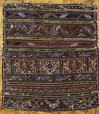 Kurd Qoo-chan Soumac Bagface, ca.1890; 2’9 x 2’4” / 79 x 71 cm.

Decorated with bands of hooked diamonds not unlike symbols seen

on Jaf Kurdish work here set in boxes. Halved diamonds fill  ...