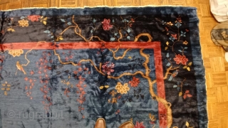 Chinese carpet, ca. 1900; 9’11 x 13’2” / 302 x 401 cm. 

Exceptionally glossy wool with hand-spun warps, flowering gnarled trees with butterflies and birds in field, medium blue 

ground, solid red  ...