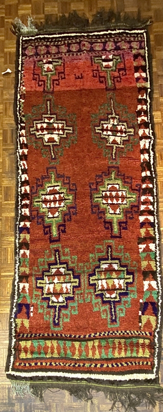 Uzbek long rug/ carpet with Gabbeh weave, ca. 1890, 4’11” x 11’9” / 150 x 358 cm.

Three shade of red in the ground, two madder reds and one slightly tip-faded red-violet which  ...