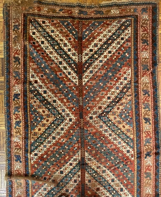 NWP Long Rug, ca. 1850; 4’2” x 9’4” / 127 x 284 cm

Field composed of brightly colored, diagonal stripes converging at central trunk or stem.

possibly an abstracted tree. Stripes in madder red,  ...