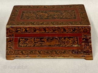 Antique Burmese Wooden Lacquer Box, ca. 16th - 19th Century CE; 

Length: 13 1/4” // 34 cm; Width: 8” // 20 cm; Height: 6 1/8” // 16 cm

Roughly a trapezoidal pyramid, the  ...