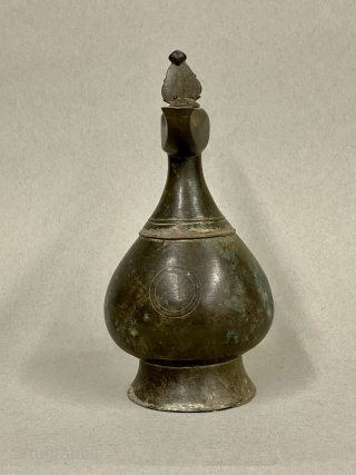 Seljuk Bronze Ewer, ca. 12th Century CE;

Diameter:  4 3/8” // 11.1 cm

Height - including crest:  9 5/8” // 24.4 cm

Diameter Base: 3 5/8” // 9.2 cm

Antique, gracefully pear-shaped ancient bronze  ...