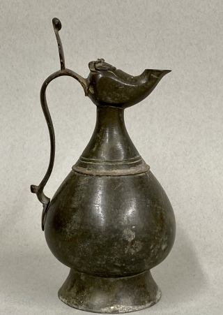 Seljuk Bronze Ewer, ca. 12th Century CE;

Diameter:  4 3/8” // 11.1 cm

Height - including crest:  9 5/8” // 24.4 cm

Diameter Base: 3 5/8” // 9.2 cm

Antique, gracefully pear-shaped ancient bronze  ...