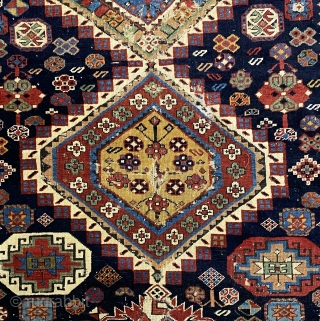 Antique Shirvan Karagashli Caucasian rug, ca. 1870; 4’ x 7’ / 122 x 213 cm

Three multicolored hexagonal diamond medallions and red-palmette finials set

on a deep indigo field. Multitudinous totemic emblems resembling flower-heads

surround  ...