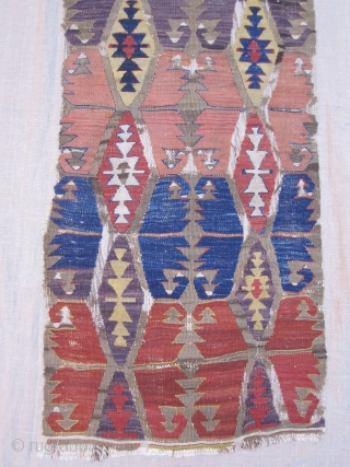 Central Anatolian Kilim fragment....pre-1850 ( all vegetal dyes).... profess. mounted on linen.....fragment size is  22" x 56" (56cm x 142cm )           
