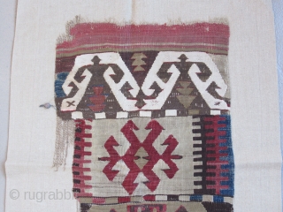 Anatolian kilim border fragment....Southeast Anatolia ( Reyhanli ? Kurdish ?) before 1825....wool w/ cotton-ground end-panel...very fine weave....frag. size 1'4" x 5"( 40 x 155 cm) ....unusual archaic motif drawings...professionally mounted on linen....condition  ...