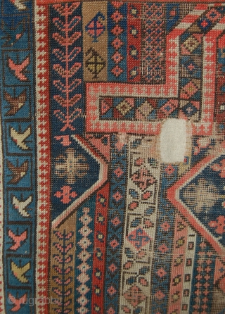 Karabakh prayer rug. It has a design of thin, vertical, multi-coloured stripes. The stripes are filled with tiny motifs linked together. In the axis of the mihrab three diamond-shaped medallions. If I  ...