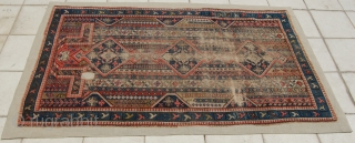 Karabakh prayer rug. It has a design of thin, vertical, multi-coloured stripes. The stripes are filled with tiny motifs linked together. In the axis of the mihrab three diamond-shaped medallions. If I  ...