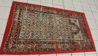 Caucasian Shirvan Prayer Rug. 
Mounted/size of the linen support(Full size): 110 x 182cm (size of the rug fragment: 100 x 172cm). 19th century, I was told over 150 years old. Provenance: The  ...