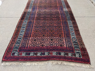 Really soft older Baluch rug or runner about 4ft x 8ft. It has really soft wool. It's in full pile with one spot near a corner with a couple knots missing. The  ...