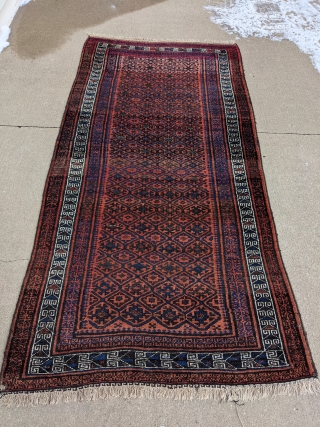 Really soft older Baluch rug or runner about 4ft x 8ft. It has really soft wool. It's in full pile with one spot near a corner with a couple knots missing. The  ...