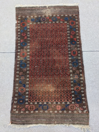 Fun little old Baluch. Great for use as a scatter rug or any space. Love that glowing red field to outline the botehs. 

5ft6in x 3ft1in or 168 x 94cm

Low pile, one  ...