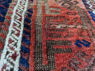 Stunning antique Baluch. 5ft 6in x 3ft 1in. Real unique center panel design. High soft wool except the corroded brown areas. Great colors.

Cheers.          