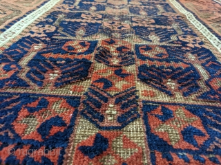 Stunning antique Baluch. 5ft 6in x 3ft 1in. Real unique center panel design. High soft wool except the corroded brown areas. Great colors.

Cheers.          